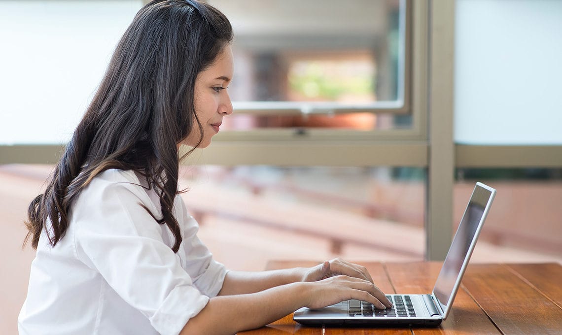 student working on laptop